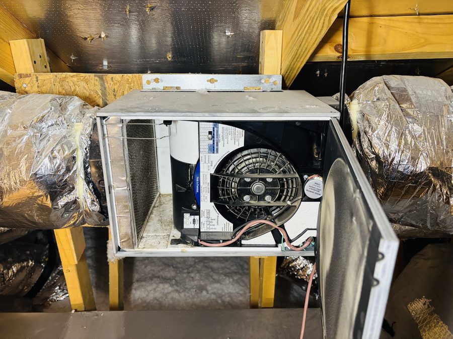 Open HVAC air handler and ductwork during an inspection